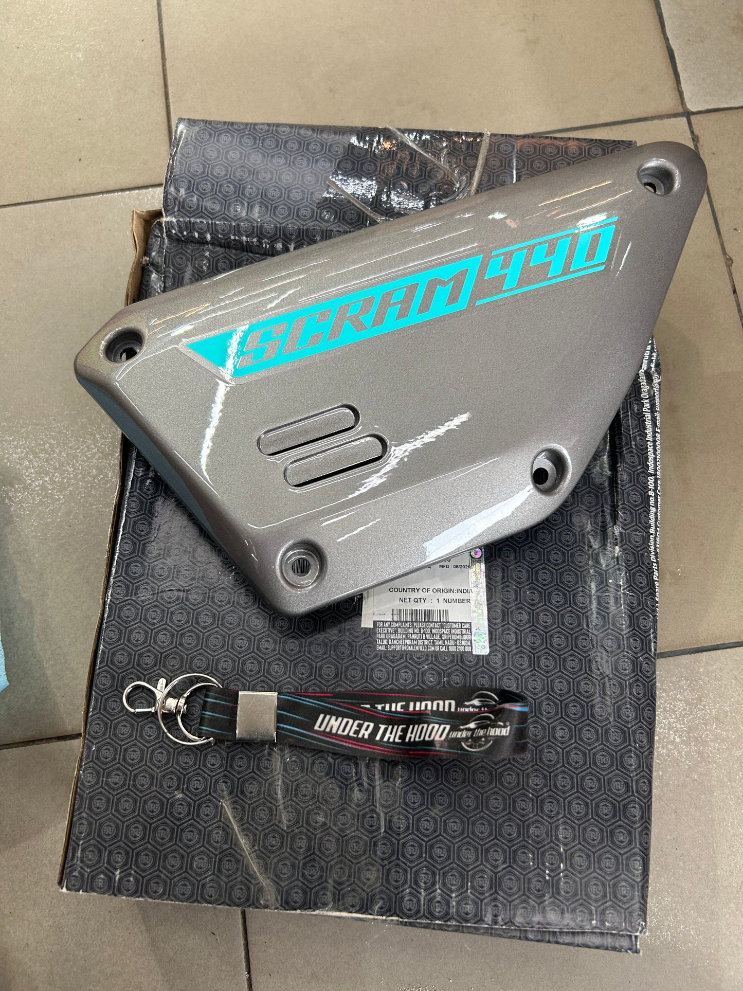 Royal Enfield RAV01747/A - Side Panel LH with Decal - SILVER WITH CYAN for Scram 440 - OEM