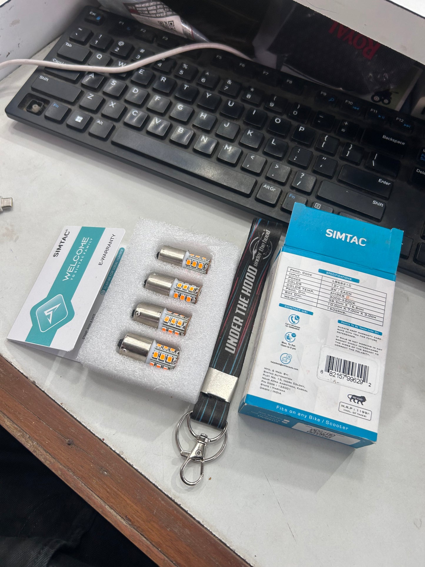 Close up of Simtac LB6S21C amber LED indicator bulb showing 360 degree reflector design