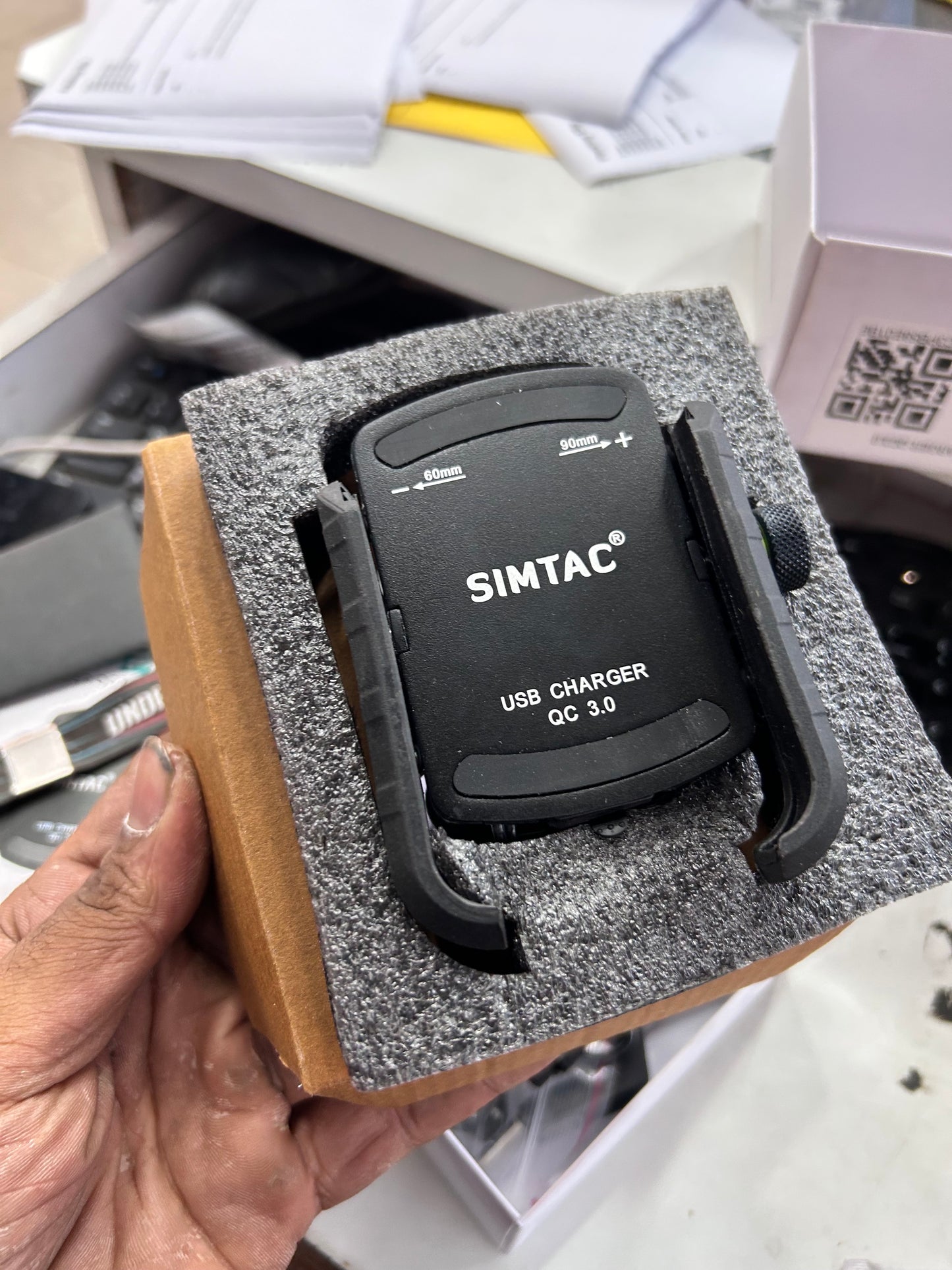 Simtac Super Grip Pro QC3.0 motorcycle phone mount package contents with spacers and wiring