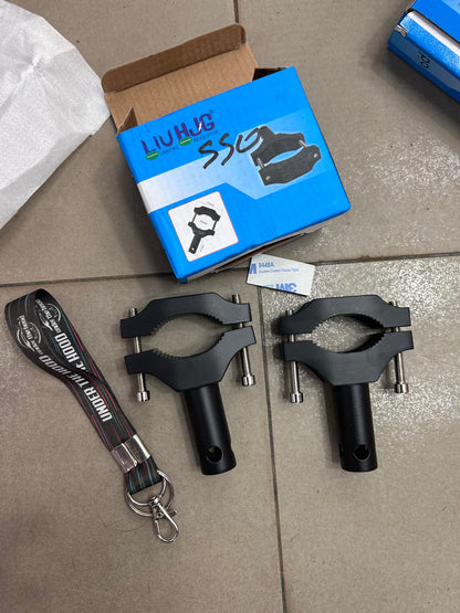 Heavy-duty LIU HJG shocker mount clamp (pair) for fog/aux lights. Fits ~50–60mm tubes (verify OD). Stable, rustproof, adjustable.